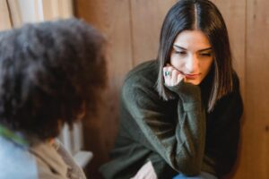 two relatives during serious conversation about going to rehab