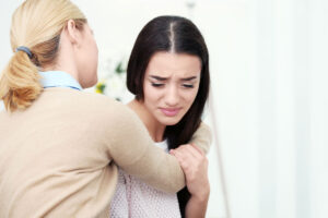 a woman with trauma being treated by a medical expert from a rehab center