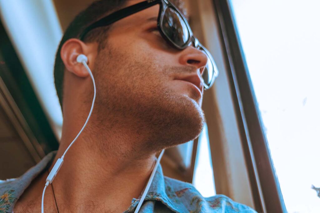 man listening to songs as music therapy