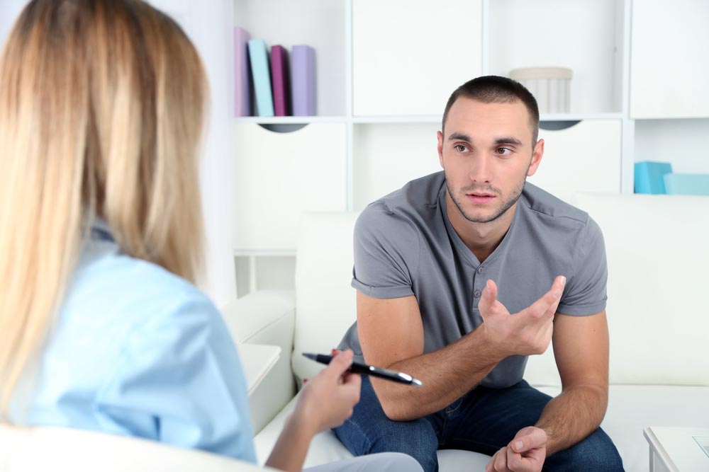 male client consulting an addiction treatment expert about intervention