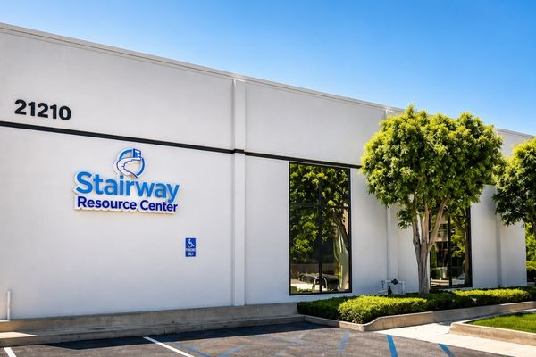 Exterior of Stairway Resource Center addiction treatment facility in Los Angeles County with modern building and landscaped entrance.